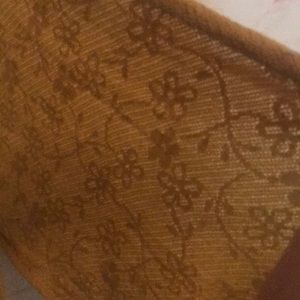 Mustard yellow scarf with flower pattern